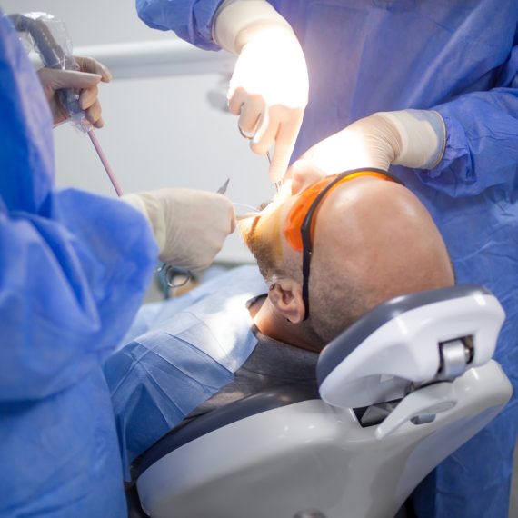 A wisdom tooth extraction surgery in progress in a dental hospital. Dental check up